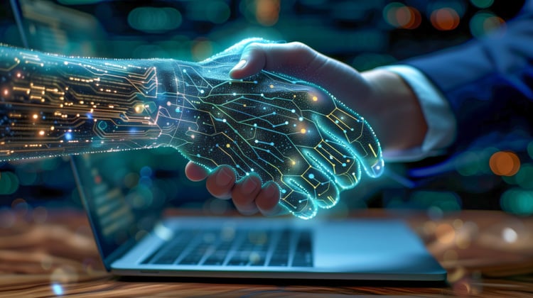 A digital AI hand shakes a human hand in front of a laptop as a symbol of trusting collaboration in AI and digital projects.